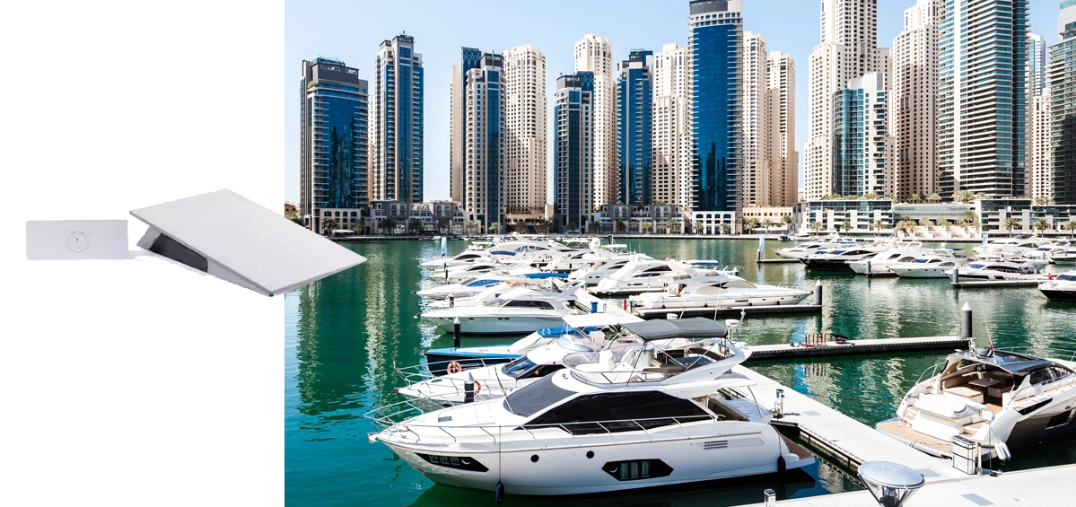 Marina full of yachts with an inset Starlink flat antenna and Pepwave router (showing combined Starlink + Peplink internet solution)
