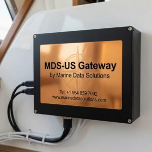 MDS US Gateway by Marine Data Solutions. Black rectangular marine network router with network cables and power cable. Provides dedicated US IP address for yacht streaming services while cruising internationally.